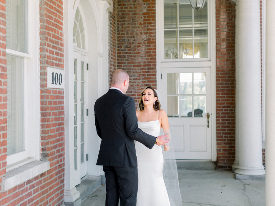 The bride and groom do a first look before their Stephens College wedding photographed by Missouri wedding photographer Love Tree Studios.