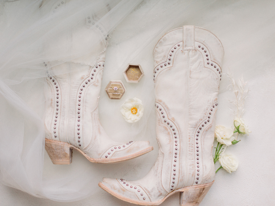 The bride's cowboy boots for her Atrium on Tenth wedding in Columbia, Missouri by Love Tree Studios.