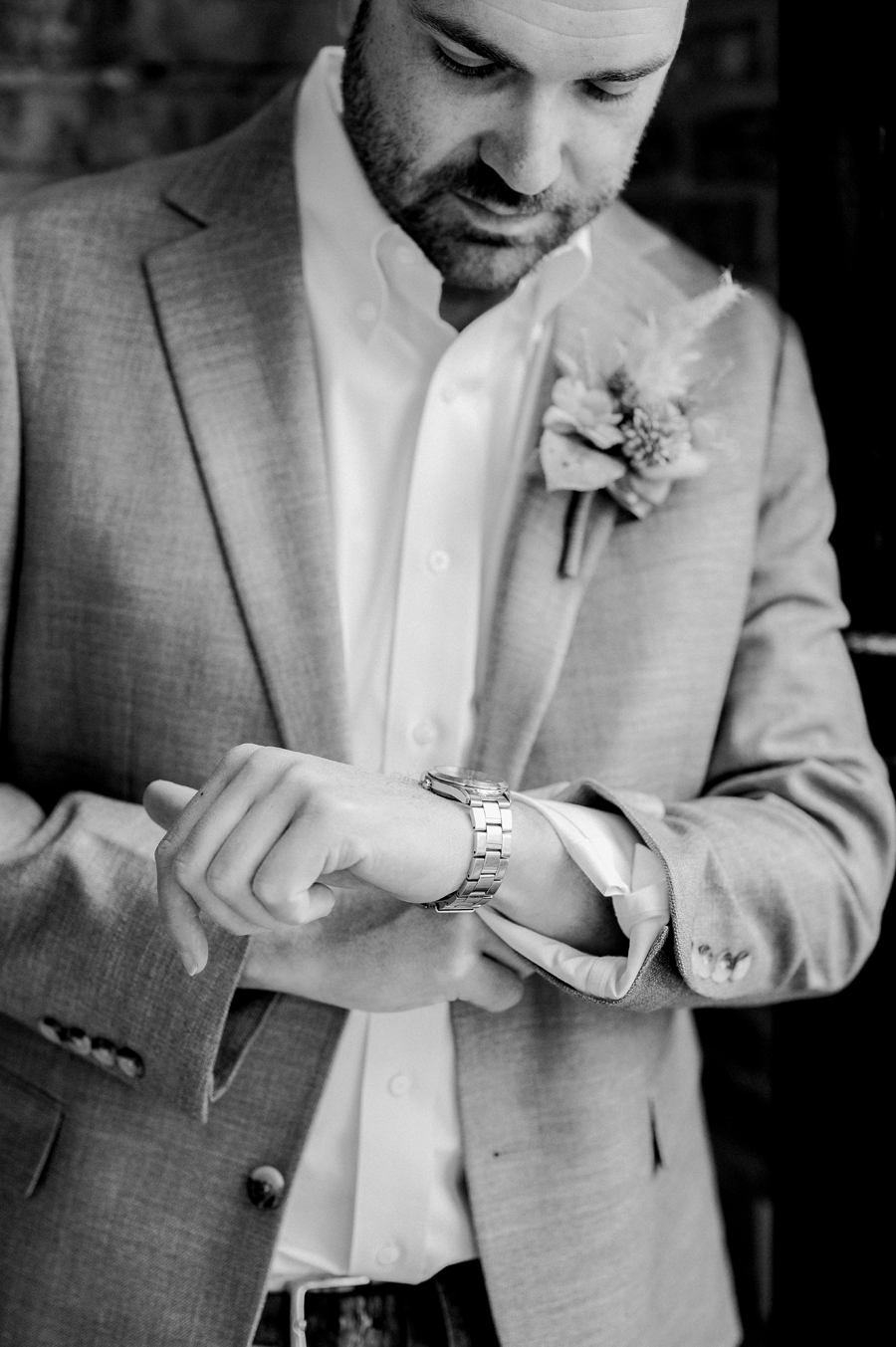 The groom prepares for his Atrium on Tenth wedding in Columbia, Missouri by Love Tree Studios.
