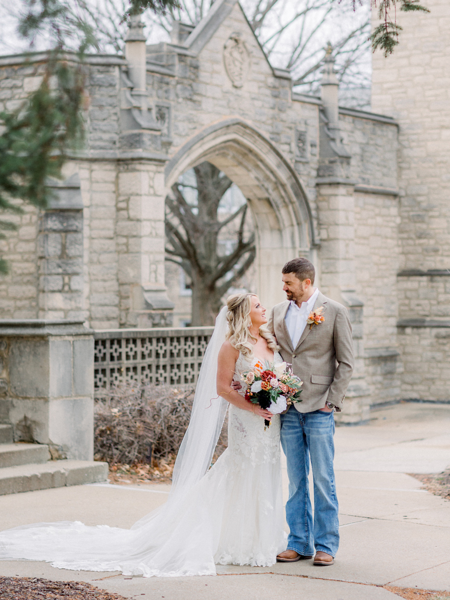 The bride and groom pose for portraits on Mizzou campus before their Atrium on Tenth wedding in Columbia, Missouri by Love Tree Studios.