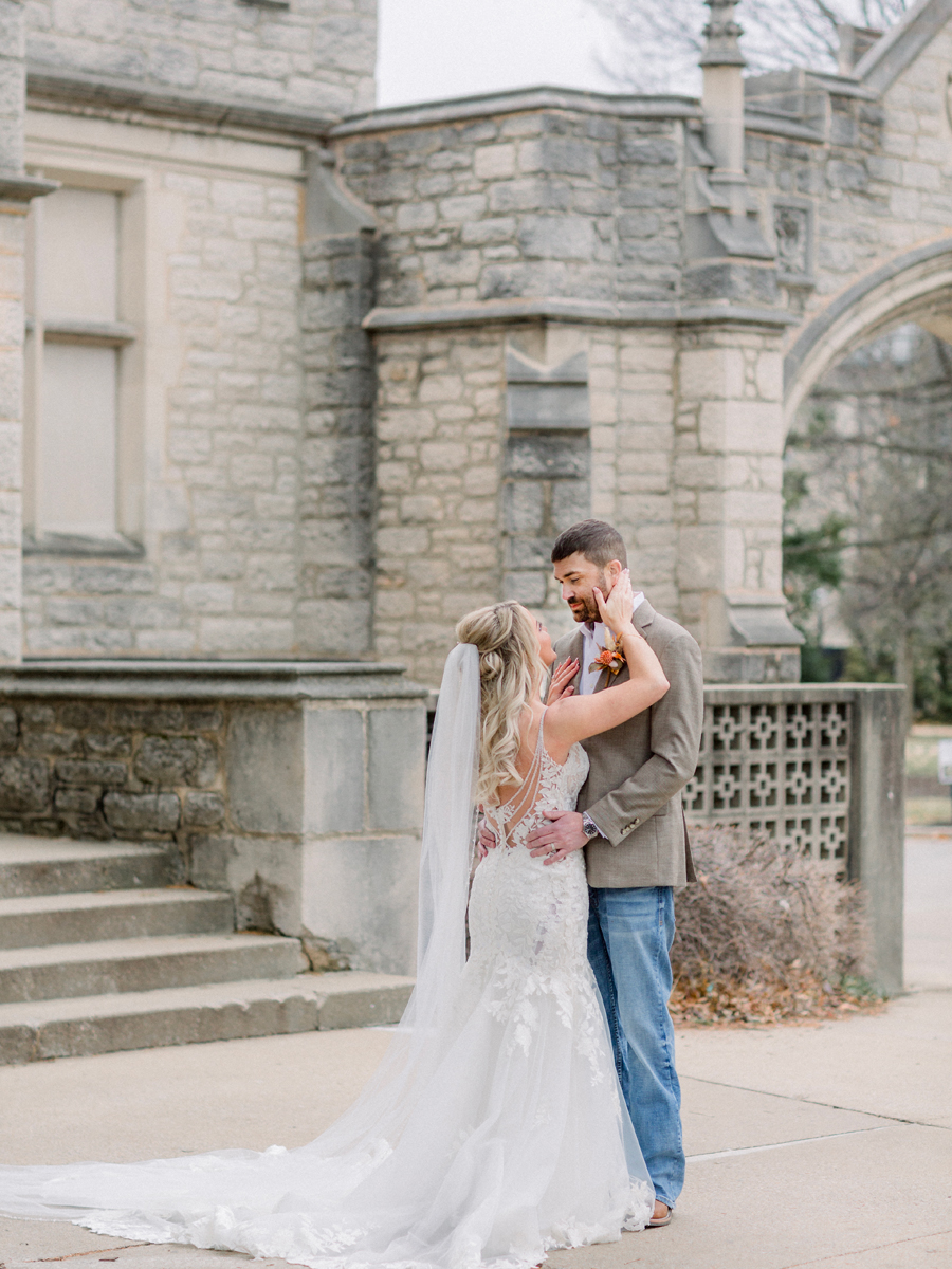 The bride and groom pose for portraits on Mizzou campus before their Atrium on Tenth wedding in Columbia, Missouri by Love Tree Studios.