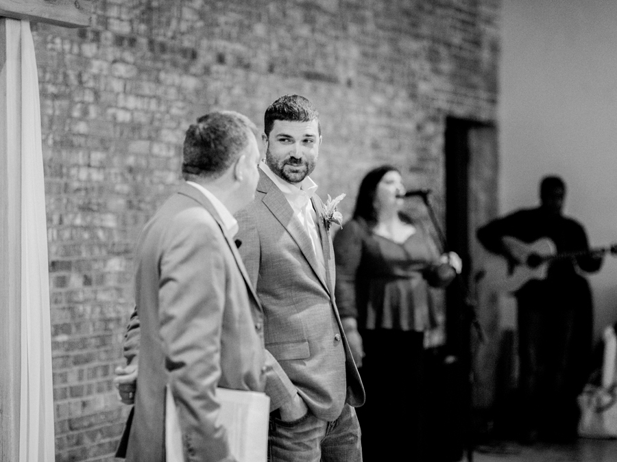 Guests gather for a wedding at Atrium on Tenth wedding in Columbia, Missouri by Love Tree Studios.