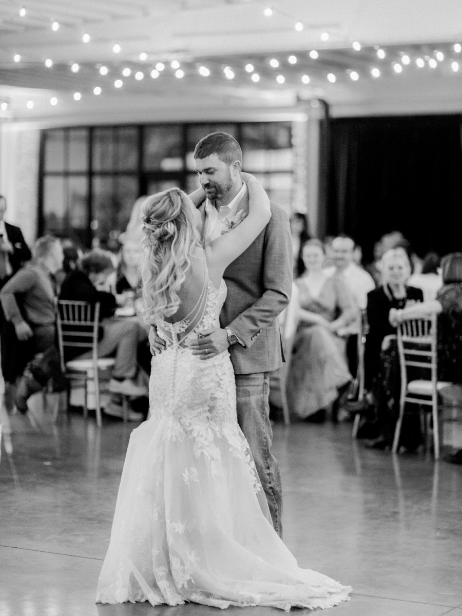 A bride and groom dance at their wedding at the Atrium on Tenth wedding in Columbia, Missouri by Love Tree Studios.