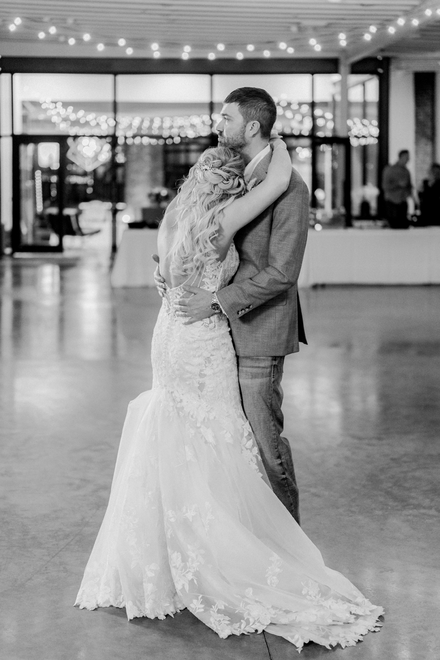 A bride and groom dance at their wedding at the Atrium on Tenth wedding in Columbia, Missouri by Love Tree Studios.