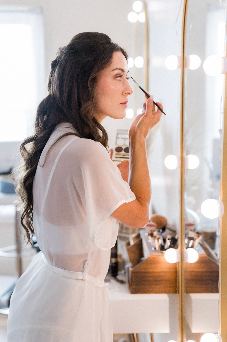 A bride gets ready for her The Atrium on Tenth wedding by Love Tree Studios.