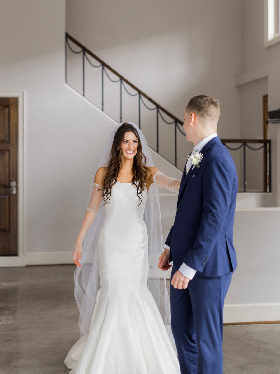 The bride and groom do a First Look at their The Atrium on Tenth wedding in Columbia, Missouri by Love Tree Studios.