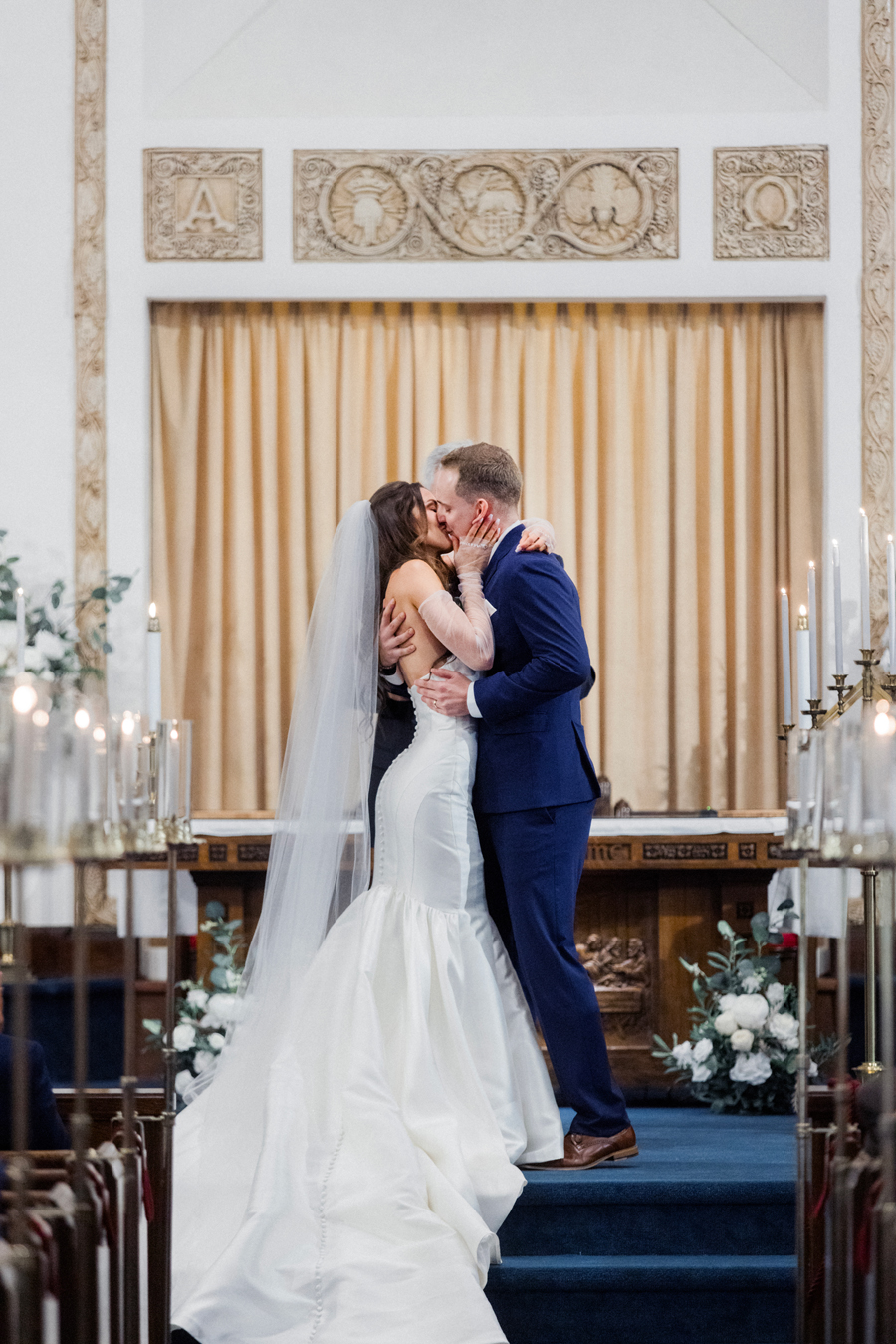 The bride and groom get married at First Christian Church before their The Atrium on Tenth wedding in Columbia, Missouri by Love Tree Studios.