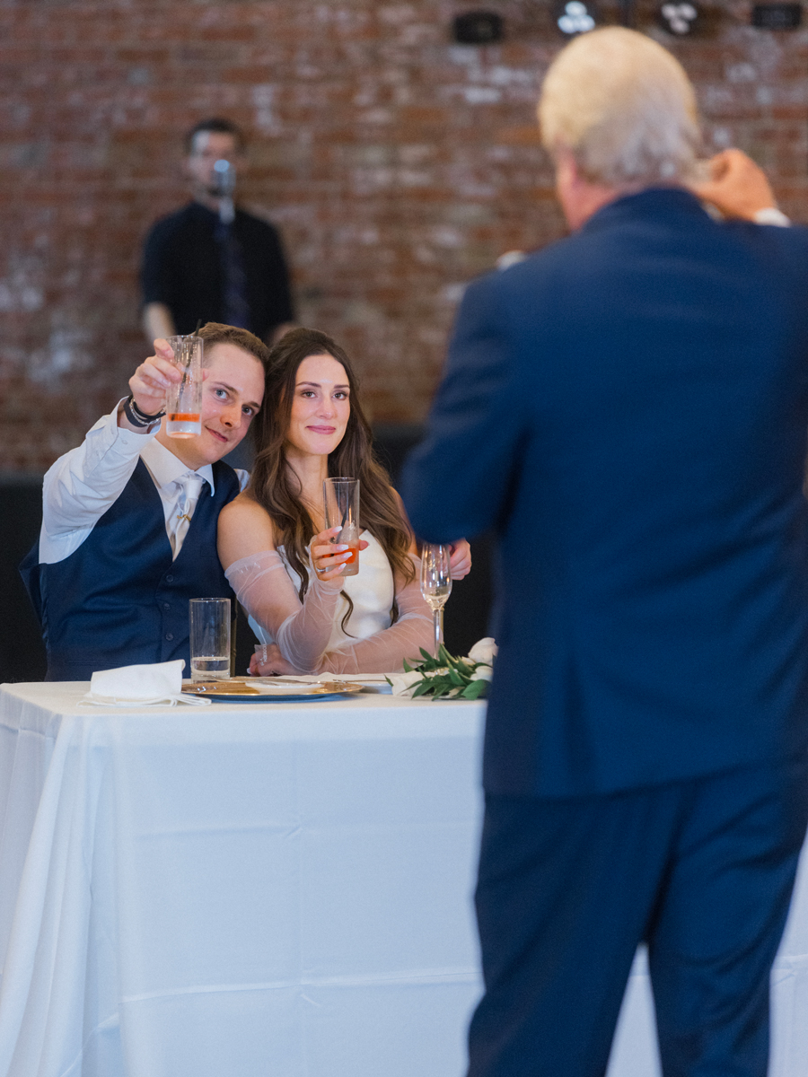 The father of the bride give a toast during the reception of a The Atrium on Tenth wedding in Columbia, Missouri by Love Tree Studios.