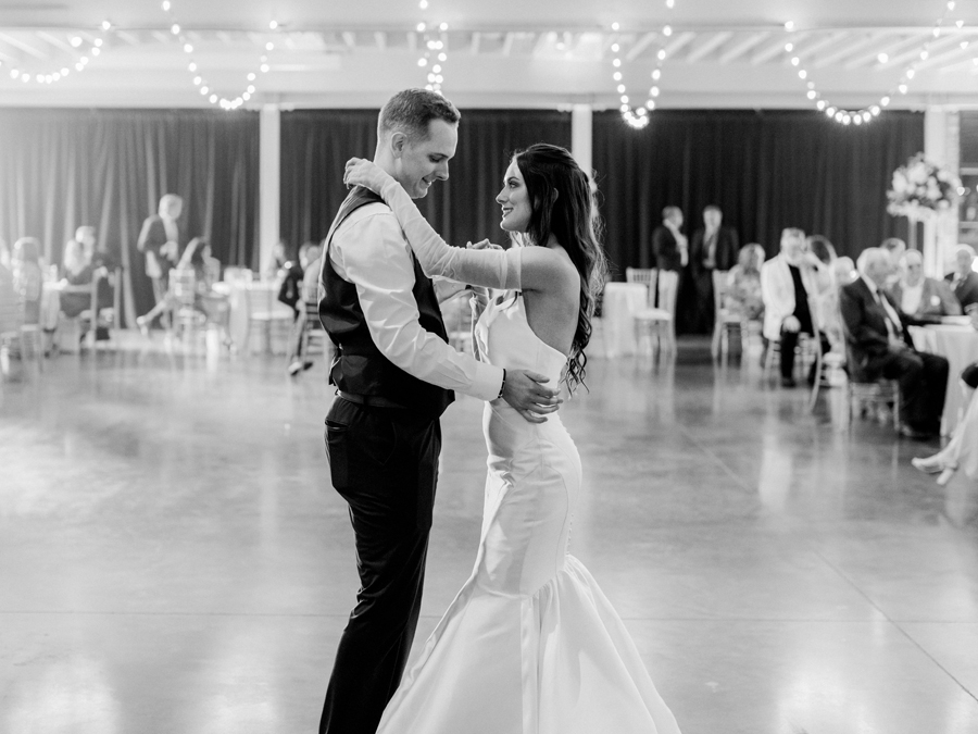 The bride and groom dance during their reception of their The Atrium on Tenth wedding in Columbia, Missouri by Love Tree Studios.