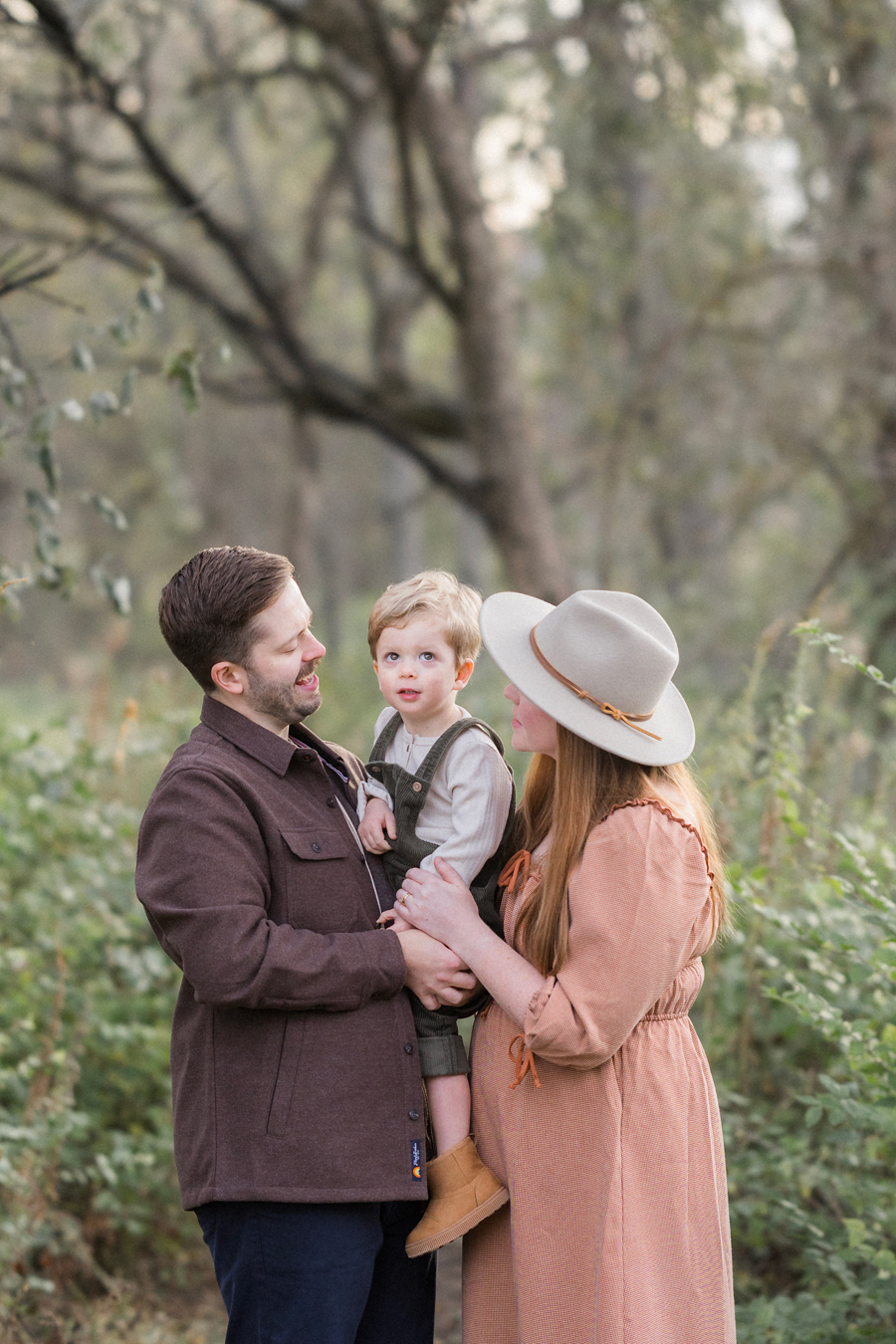 A family takes outdoor family portrait in fall by Columbia, Missouri family photographer Love Tree Studios.