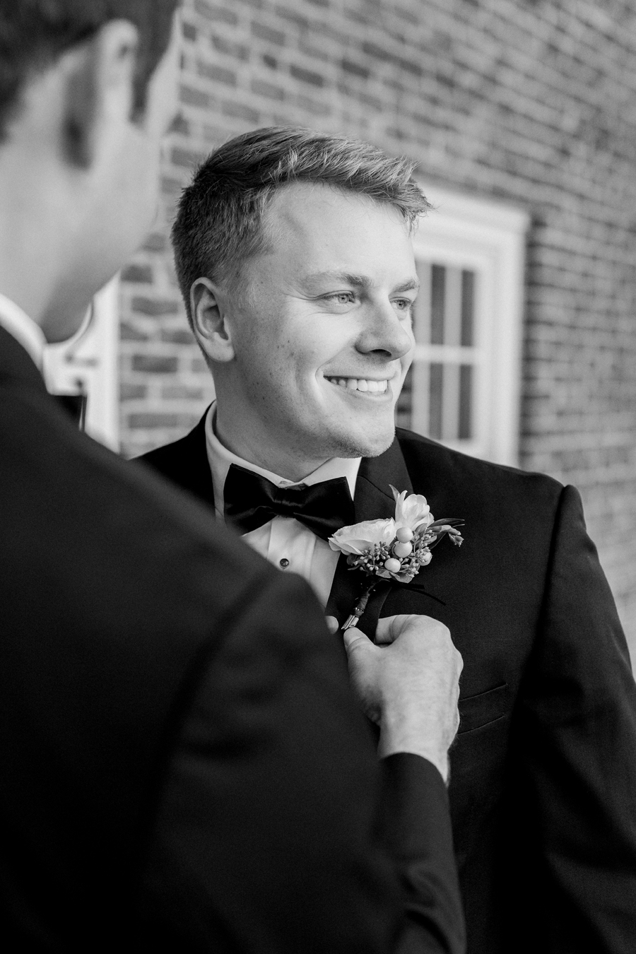 The groom prepares for his Westminster College wedding at Old Hawthorne by Love Tree Studios.