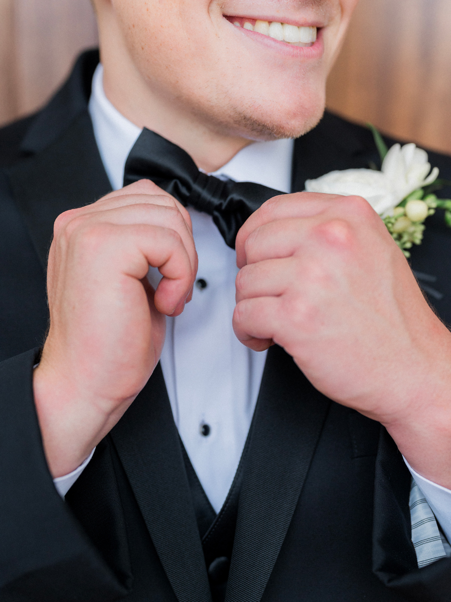 The groom prepares for his Westminster College wedding at Old Hawthorne by Love Tree Studios.