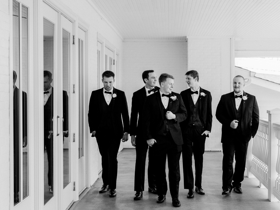 The groom poses with his groomsmen for his Westminster College wedding at Old Hawthorne by Love Tree Studios.
