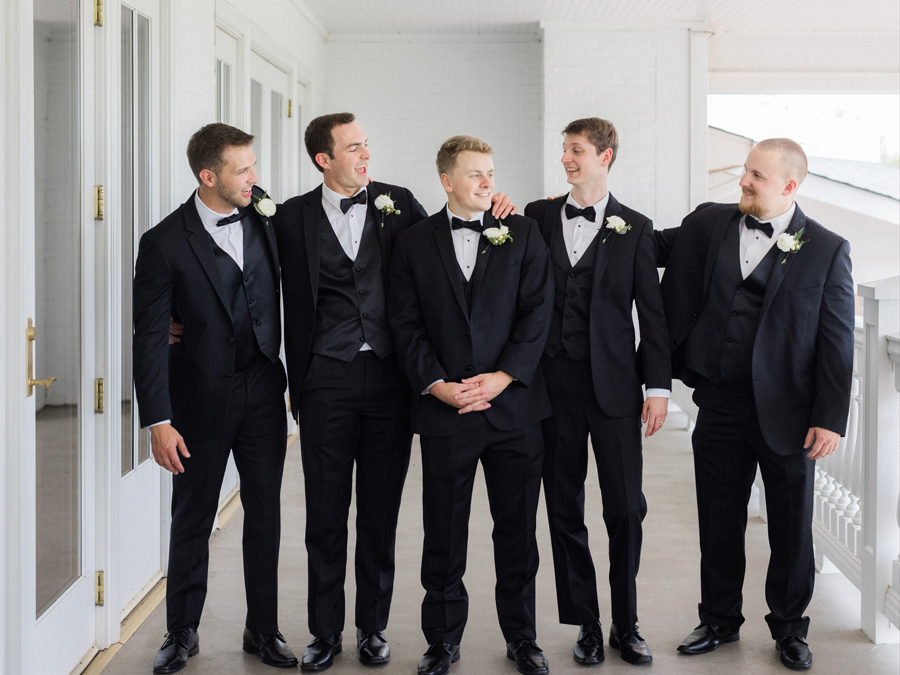 The groom poses with his groomsmen for his Westminster College wedding at Old Hawthorne by Love Tree Studios.