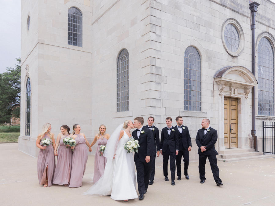 A wedding party poses for portraits at the Church of St. Mary, Aldermanbury at a Westminster College wedding by Love Tree Studios.