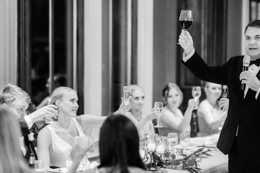 Toasts are given at a reception at the Club at Old Hawthorne for a Westminster College wedding by Love Tree Studios.