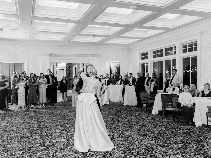 The bride and groom share their first dance during the reception at the Club at Old Hawthorne for a Westminster College wedding by Love Tree Studios.