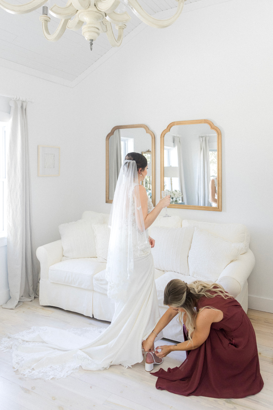 A bride puts her dress on for her Blue Bell Farm wedding by Missouri wedding photographer Love Tree Studios.