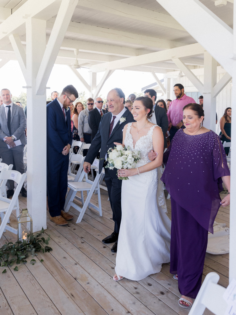 A wedding ceremony on the deck at Blue Bell Farm wedding by Missouri wedding photographer Love Tree Studios.