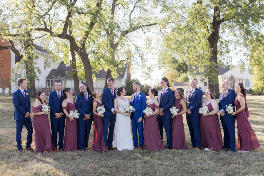 A wedding ceremony on the deck at Blue Bell Farm wedding by Missouri wedding photographer Love Tree Studios.
