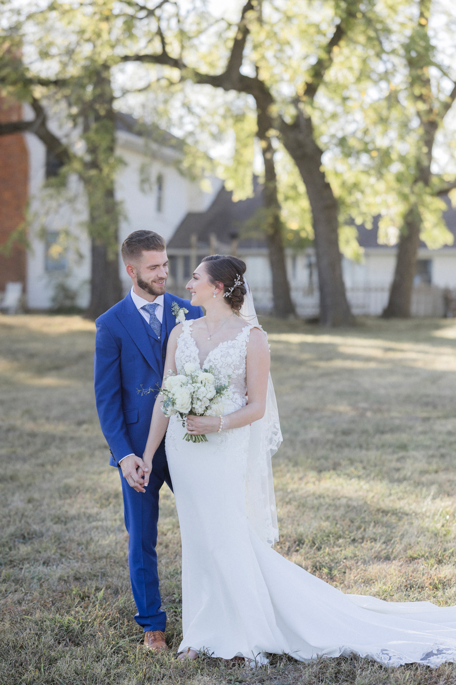 The bride and groom take portraits at their Blue Bell Farm wedding by Missouri wedding photographer Love Tree Studios.