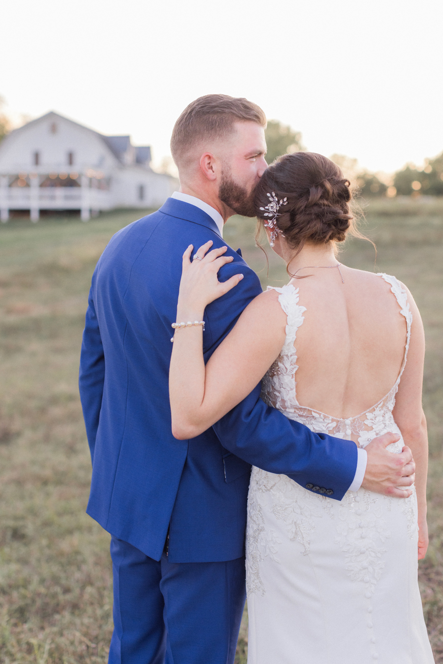 Sunset photos with the bride and groom at their Blue Bell Farm wedding by Missouri wedding photographer Love Tree Studios.