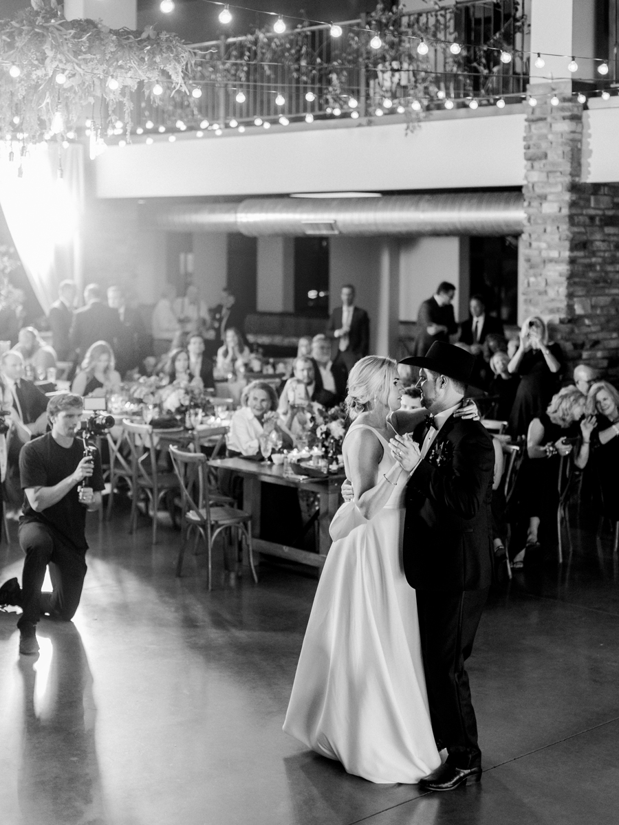 The bride and groom dance at Capital Bluffs during their Jefferson City wedding photographed by Love Tree Studios.