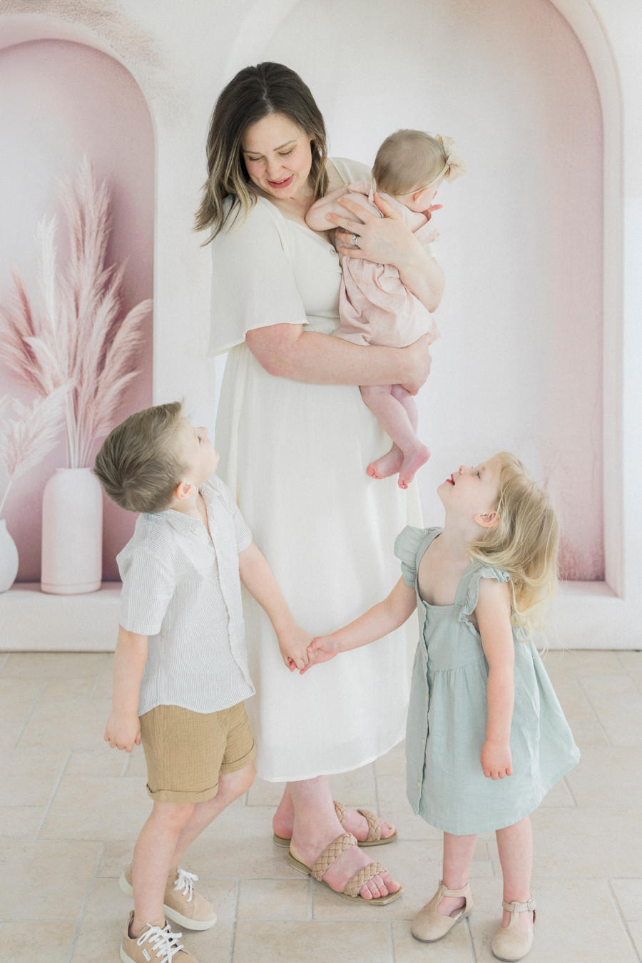A beautiful mother poses with her three children for a motherhood mini session by Columbia, Missouri family photographer Love Tree Studios.