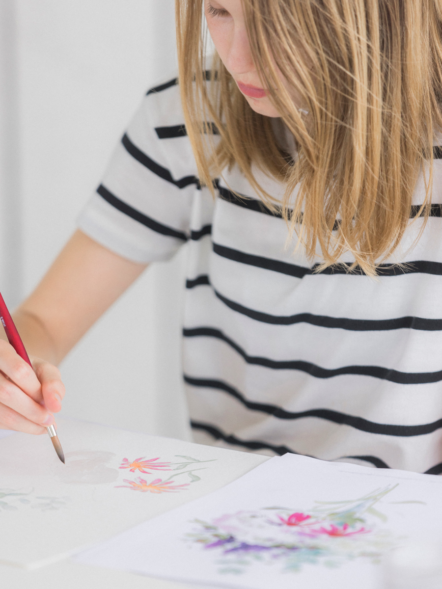 Close-up of an attendee’s watercolor painting in progress, highlighting the creative spirit of the Blue Bell Farm paint and picnic event.