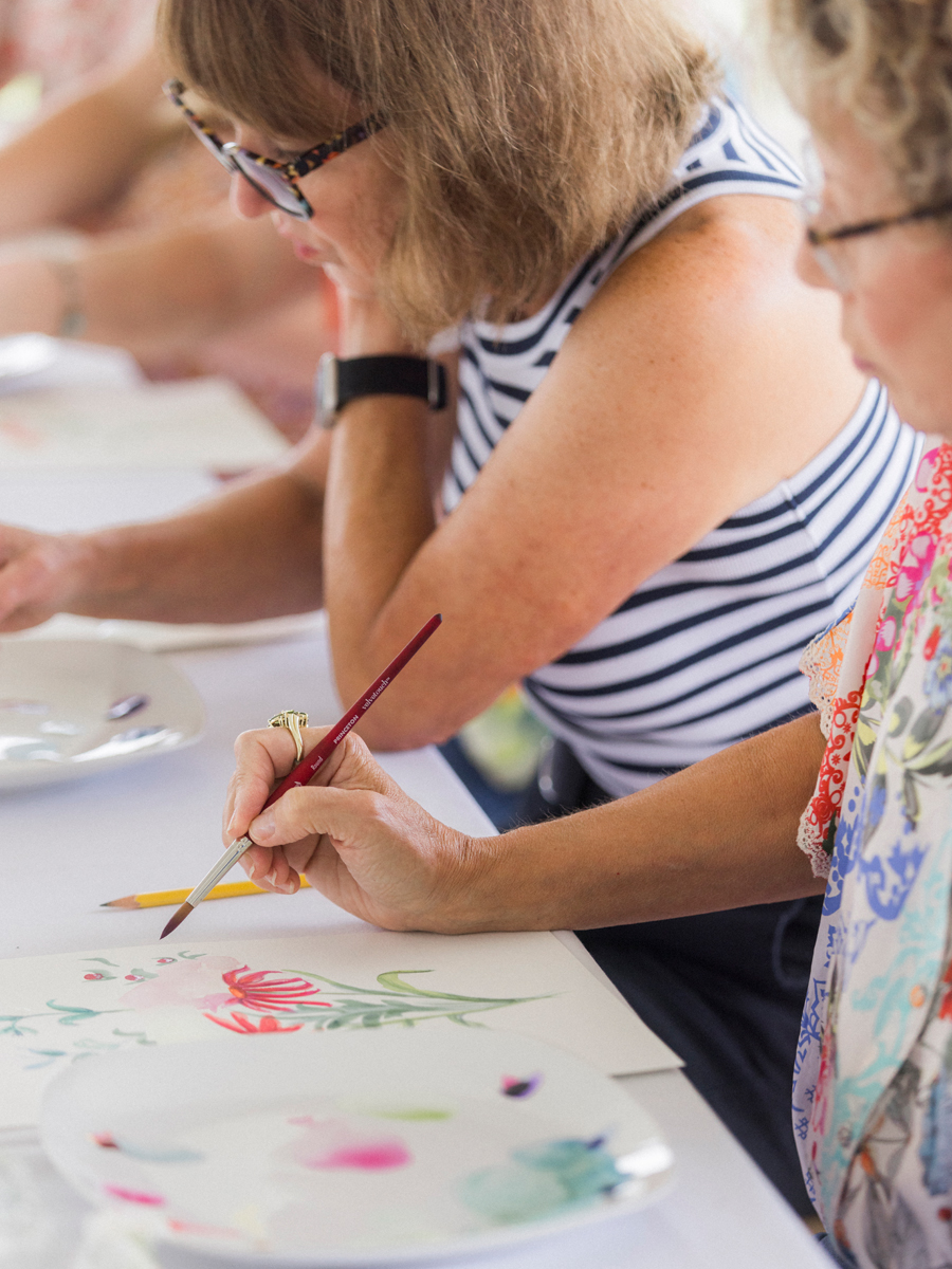 Close-up of an attendee’s watercolor painting in progress, highlighting the creative spirit of the Blue Bell Farm paint and picnic event.