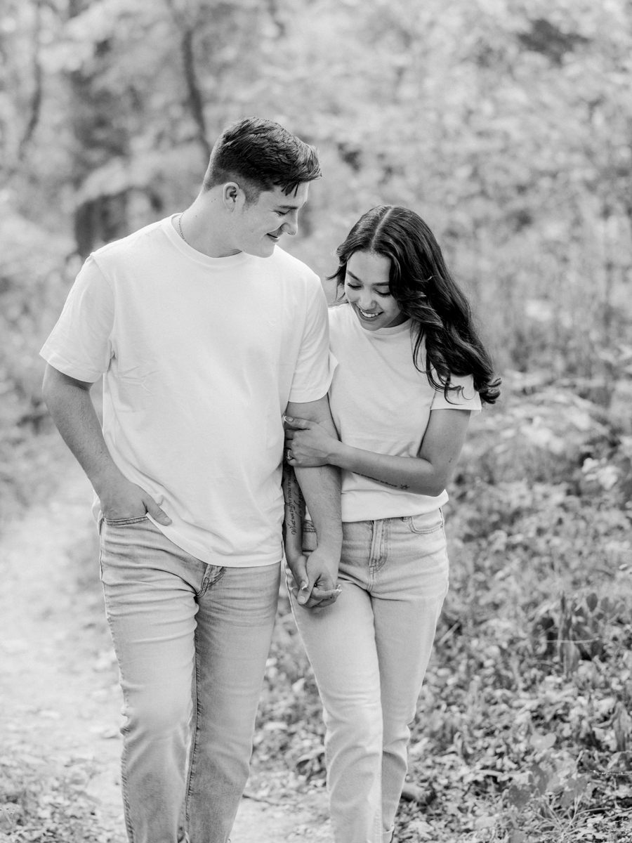 Bryanna and Chase walking through a wooded trail in Columbia, Missouri.