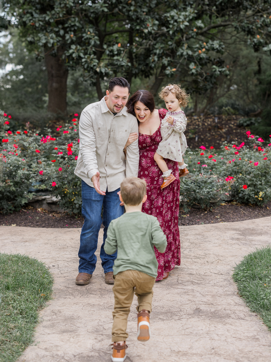 The Bahner family laughing together, capturing a joyful moment during the session.