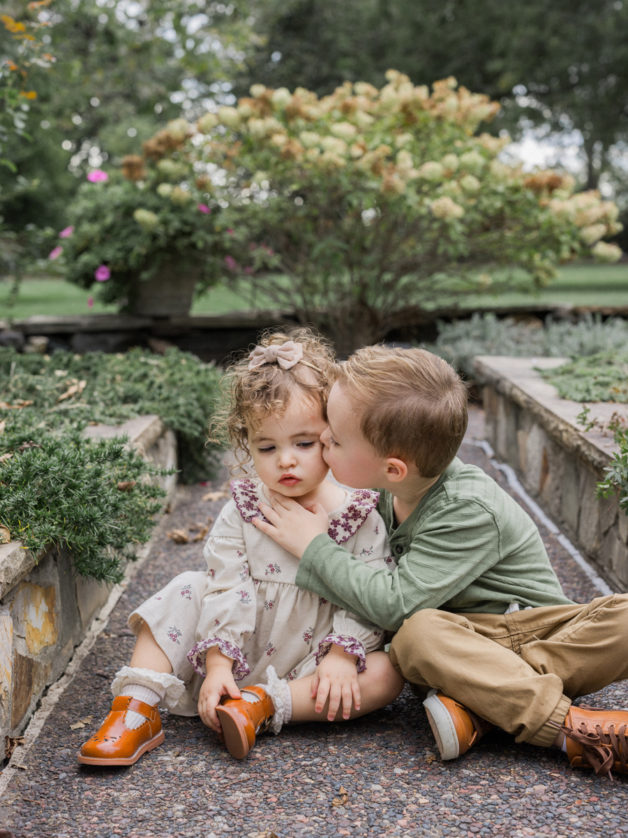 Macklin giving Mariah a gentle kiss on the cheek, capturing their bond.