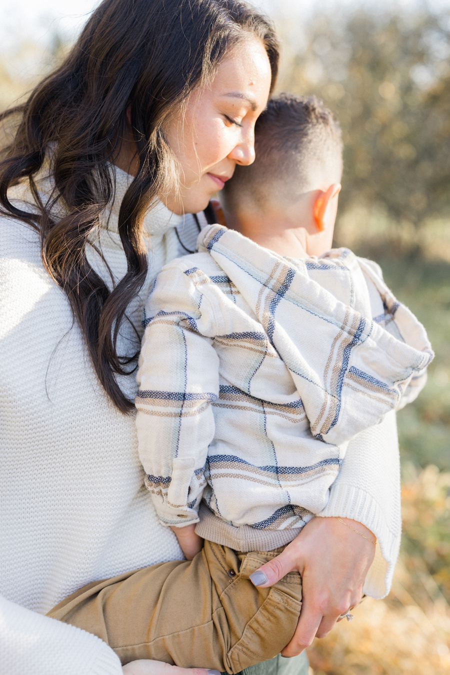 Mom hugging Myles at their Pierpont Farms Family Session, photographed by Love Tree Studios.