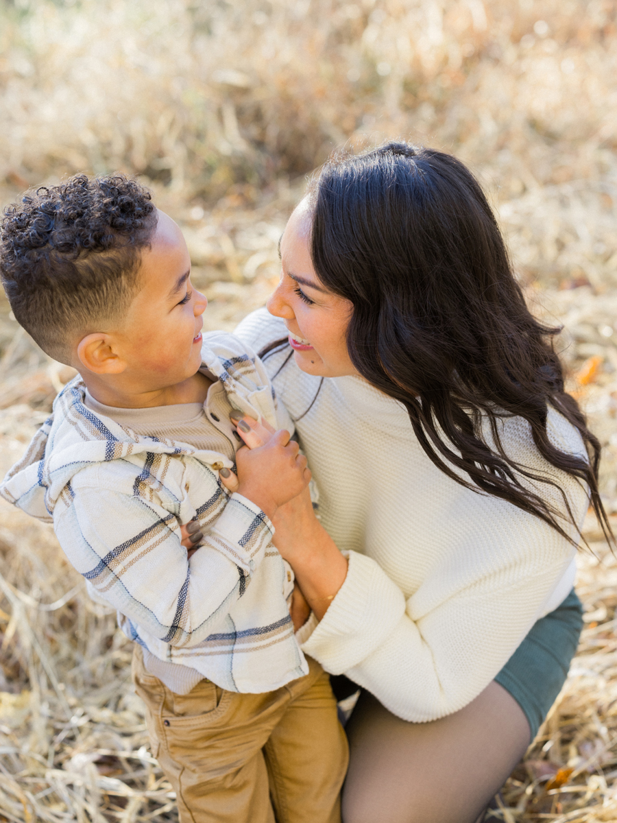 Myles tickling Mom at Pierpont Farms Family Session, photographed by Love Tree Studios.