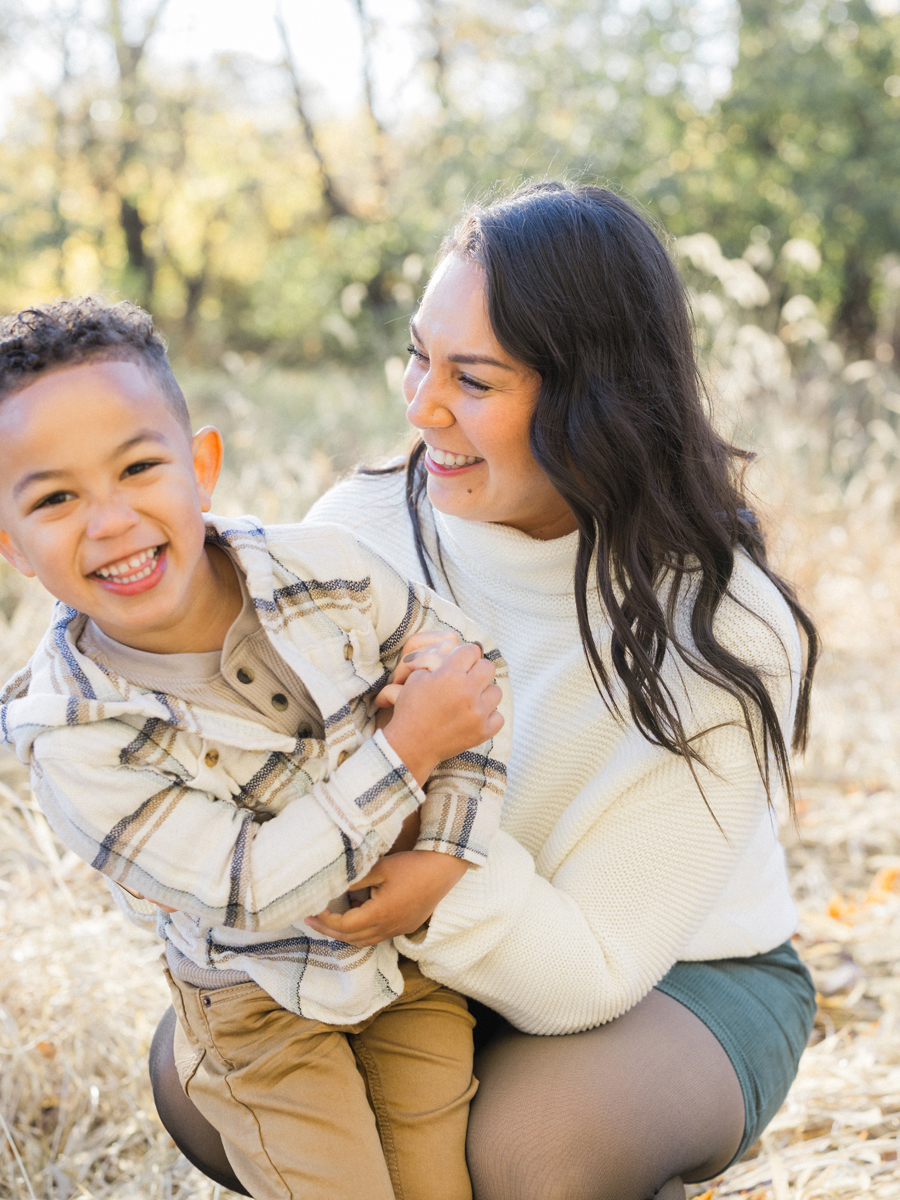 Myles running through a golden field at Pierpont Farms Family Session, photographed by Love Tree Studios.