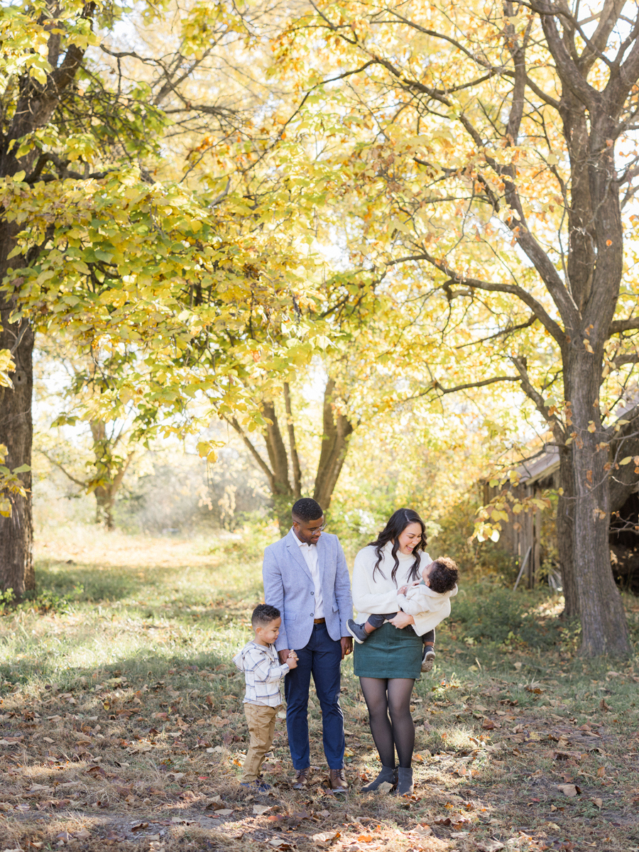 Mom and Dad posing with Myles and Theo during their Pierpont Farms Family Session, photographed by Love Tree Studios.