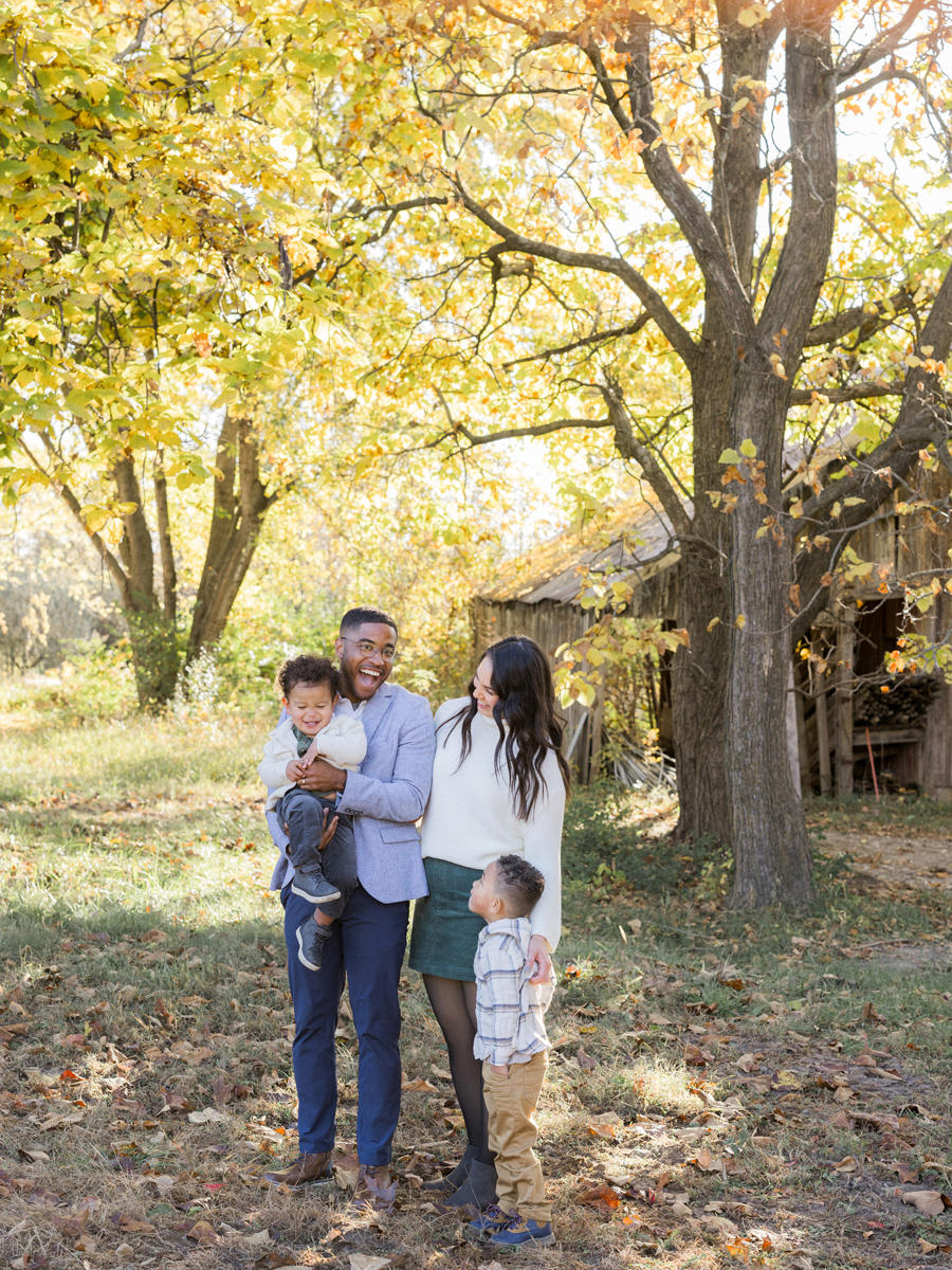 Candid shot of Theo laughing while Dad tickles him during their Pierpont Farms Family Session, photographed by Love Tree Studios.