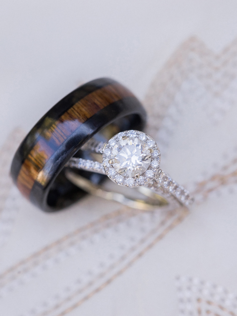 Wedding rings displayed on cowboy boots, blending rustic charm with elegance at a chic Western Missouri wedding.