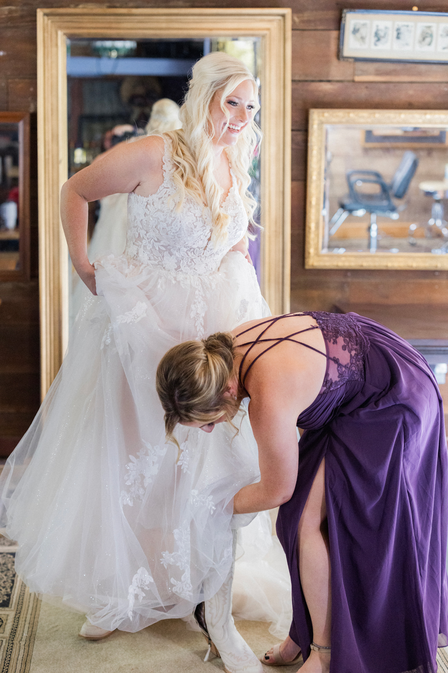 Bride getting ready with her bridesmaids for a chic Western Missouri wedding, captured by Love Tree Studios.