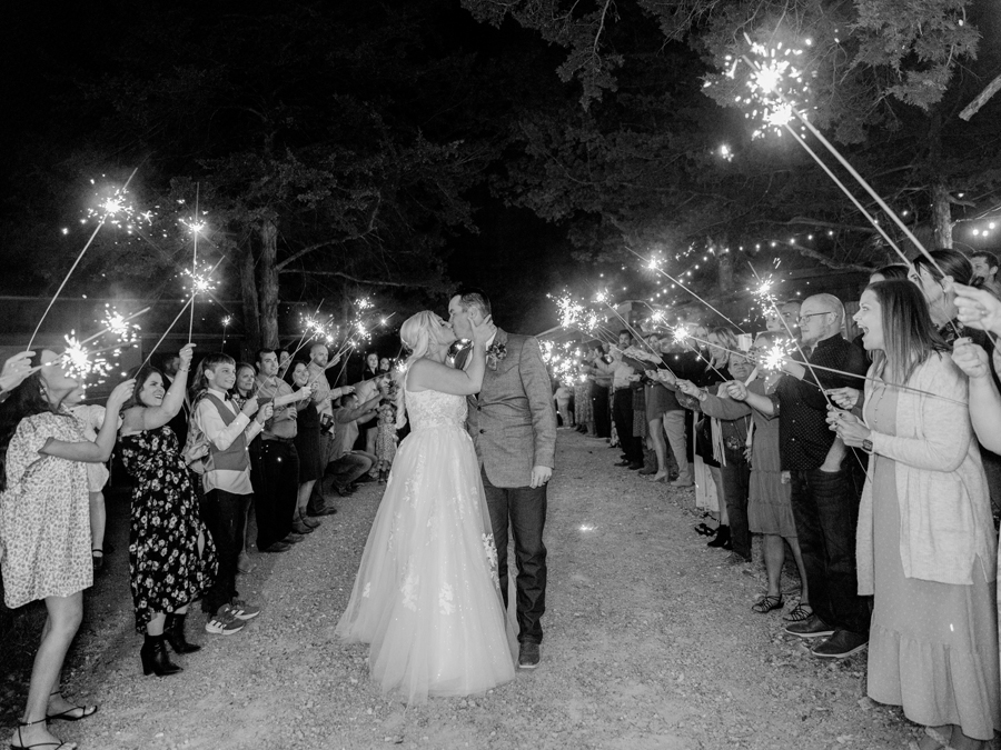 Bride and groom’s sparkler exit at their chic Western Missouri wedding, ending the night in style at Alpine Park and Gardens.