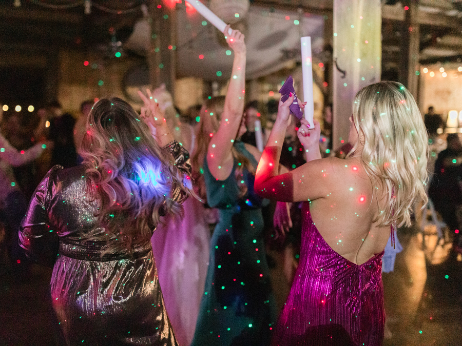 Guests enjoying the dance floor at a chic Western Missouri wedding reception, captured by Love Tree Studios