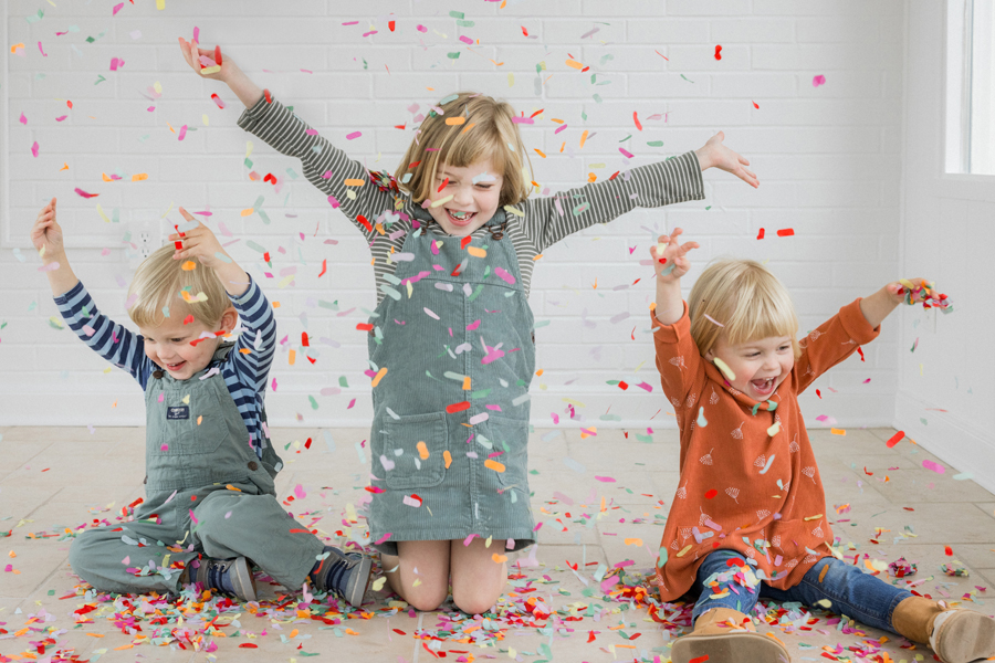 Studio family portrait fun session with vibrant colors at Love Tree Studios.