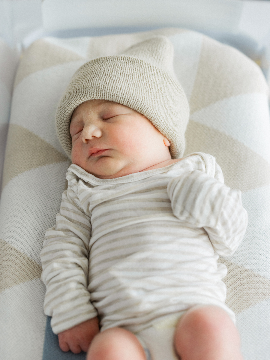 Fresh 48 photo of a newborn sleeping peacefully in a hospital bassinet, beautifully captured in black and white by Love Tree Studios.