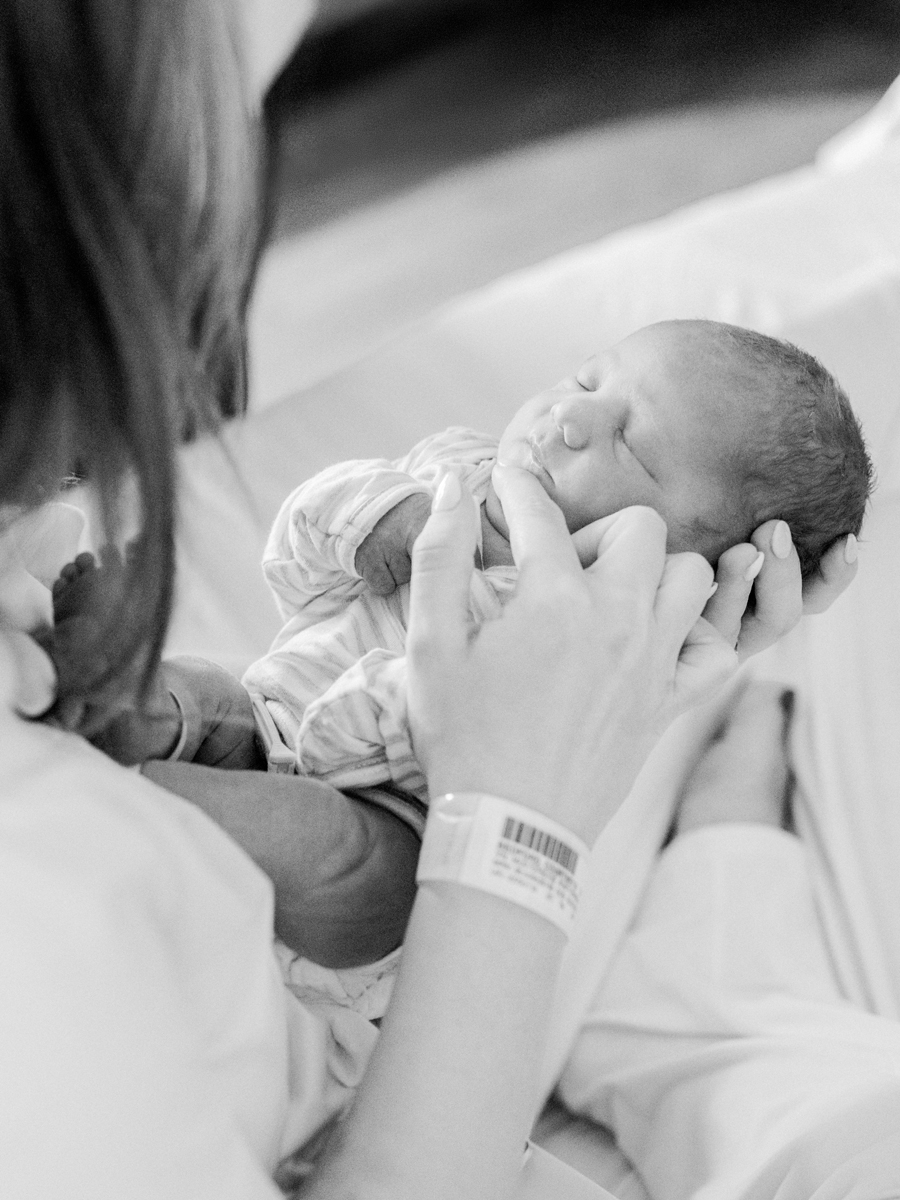 Fresh 48 photo of a baby’s peaceful expressions captured in black and white, celebrating new life.