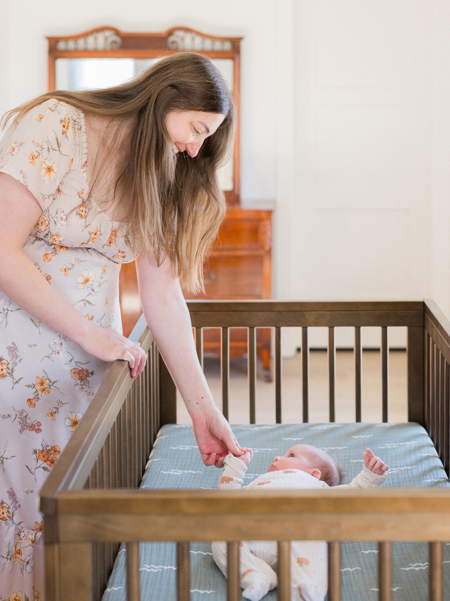 Baby Corbin Wesley in his crib during a light and airy Columbia newborn photography session by Love Tree Studios.