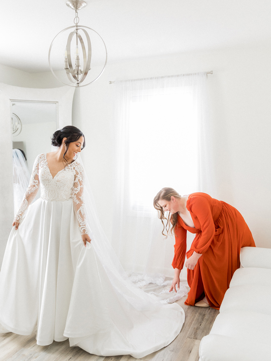 Bride looking radiant in the bridal suite at Cooper's Ridge Wedding Venue, photographed by Love Tree Studios.