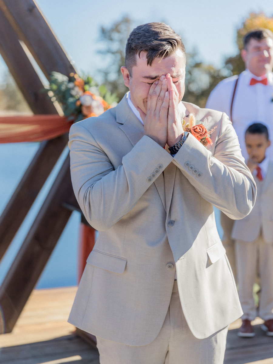 Chase's emotional reaction to seeing Bryanna for the first time at Cooper's Ridge Wedding Venue, captured by Love Tree Studios.