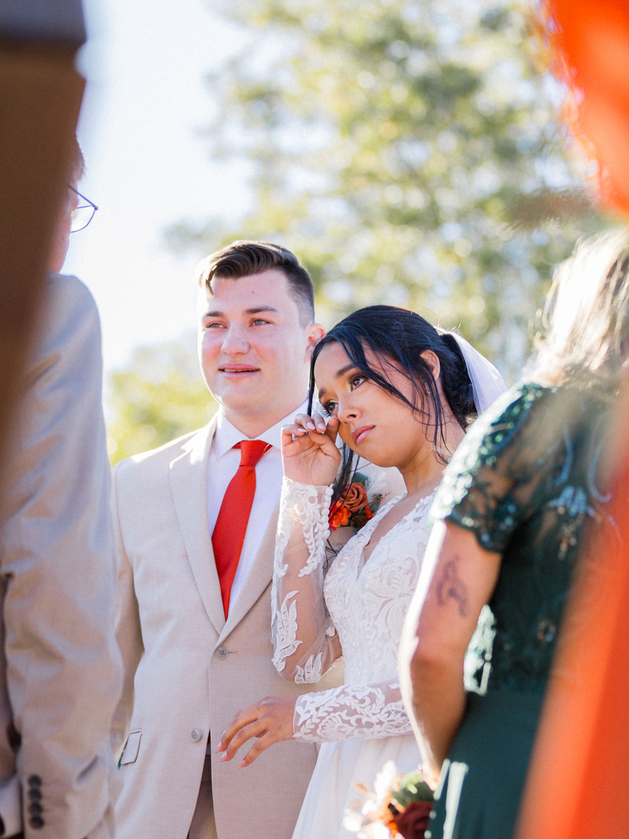 Tears of joy during Bryanna and Chase’s outdoor ceremony at Cooper's Ridge Wedding Venue, photographed by Love Tree Studios.