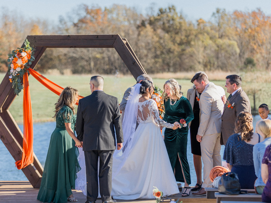 Heartwarming moments during vows at Cooper's Ridge Wedding Venue in Boonville, Missouri, captured by Love Tree Studios.